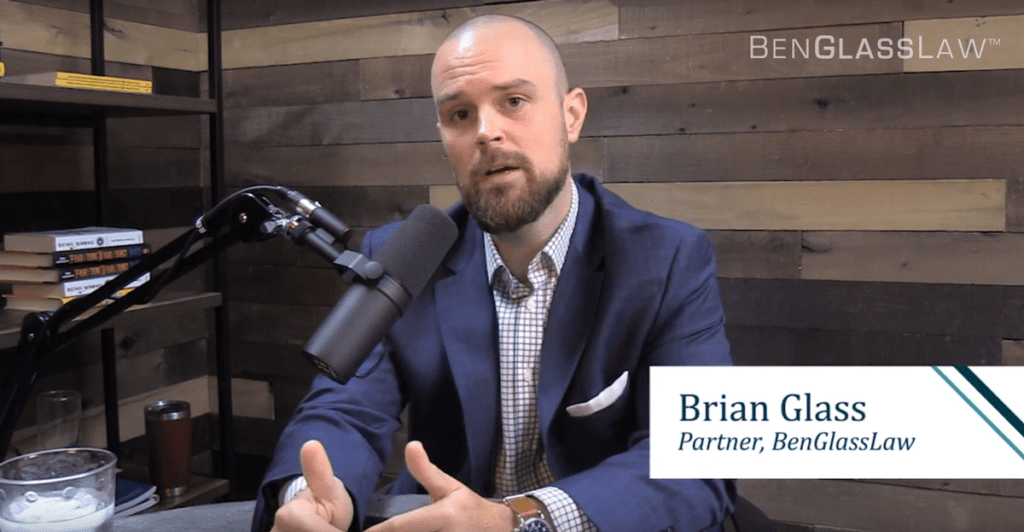 Brian Glass talking into a mic in a podcast