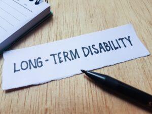 ‘Long-term disability’ is written on a scrap of paper on an experienced lawyer’s desk. Is long-term disability taxable?