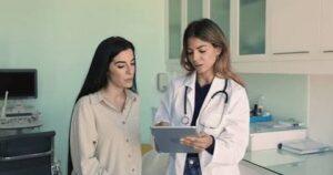 A doctor discussing POTS symptoms and treatment with a patient.